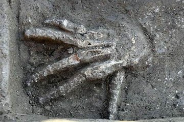 One of the hands emerges spookily from the earth which has hidden it for 3,600 years.