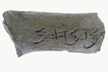 The inscribed jar handle. The name was scratched in the clay before the jar was fired.